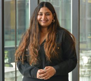 Portrait of Udita Kale, an Ohio State student, standing in front of a university building.